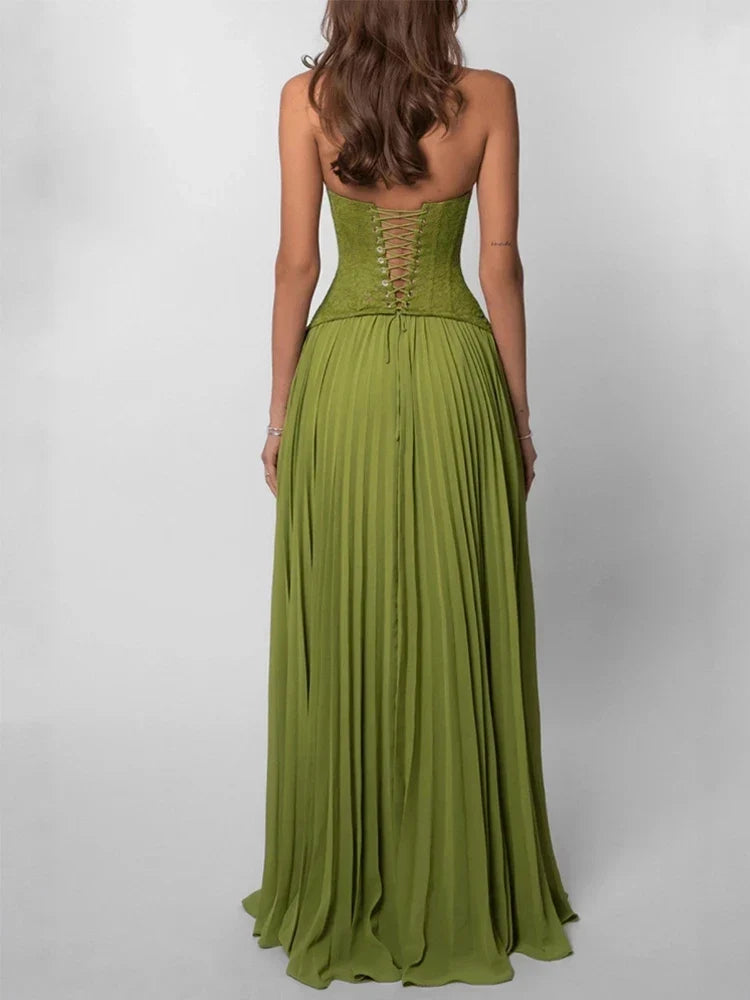 Green strapless gown with open back on a white background