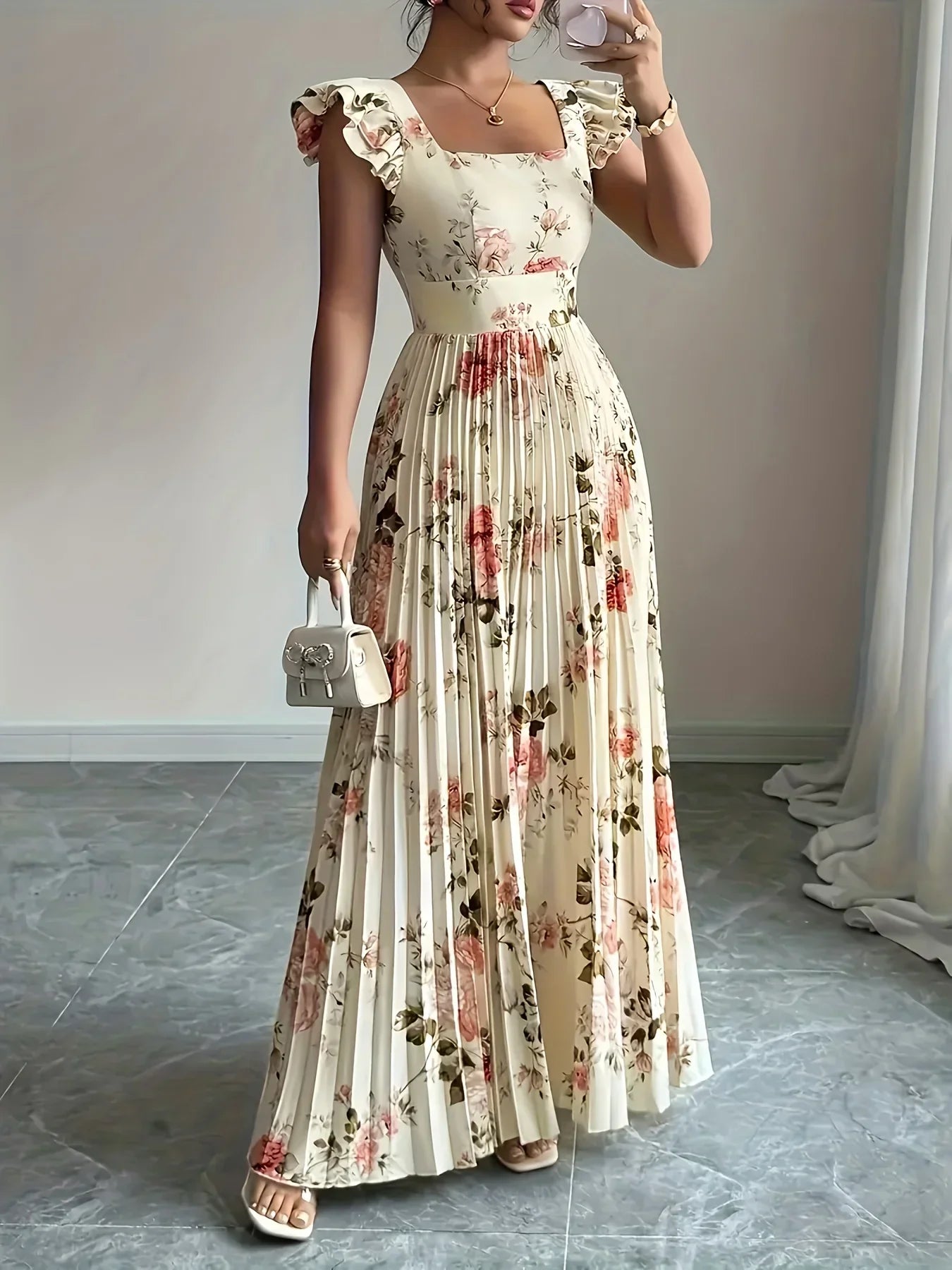 Woman wearing a floral dress in a room with a neutral background