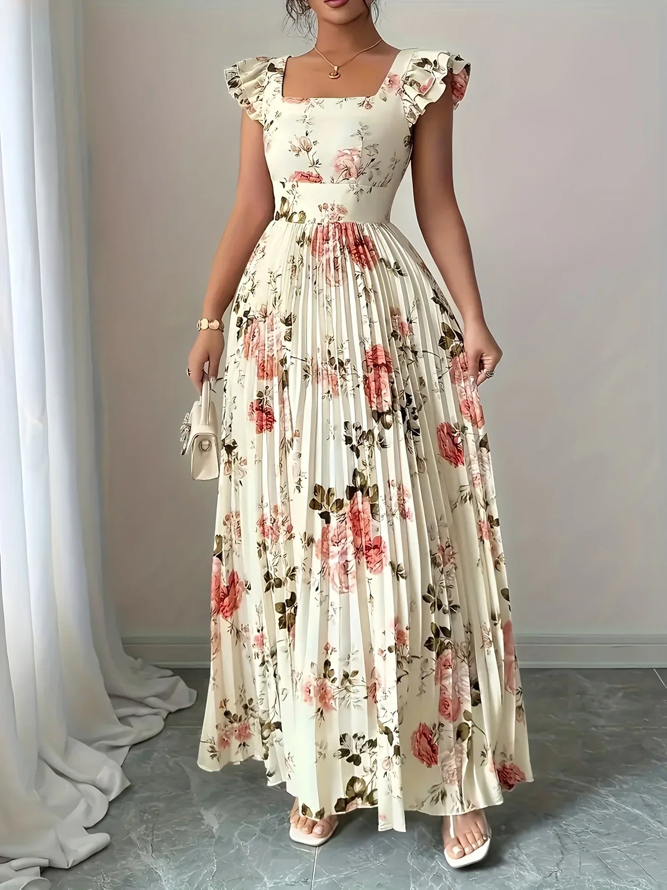 Woman wearing a floral dress standing in a room with white curtains.