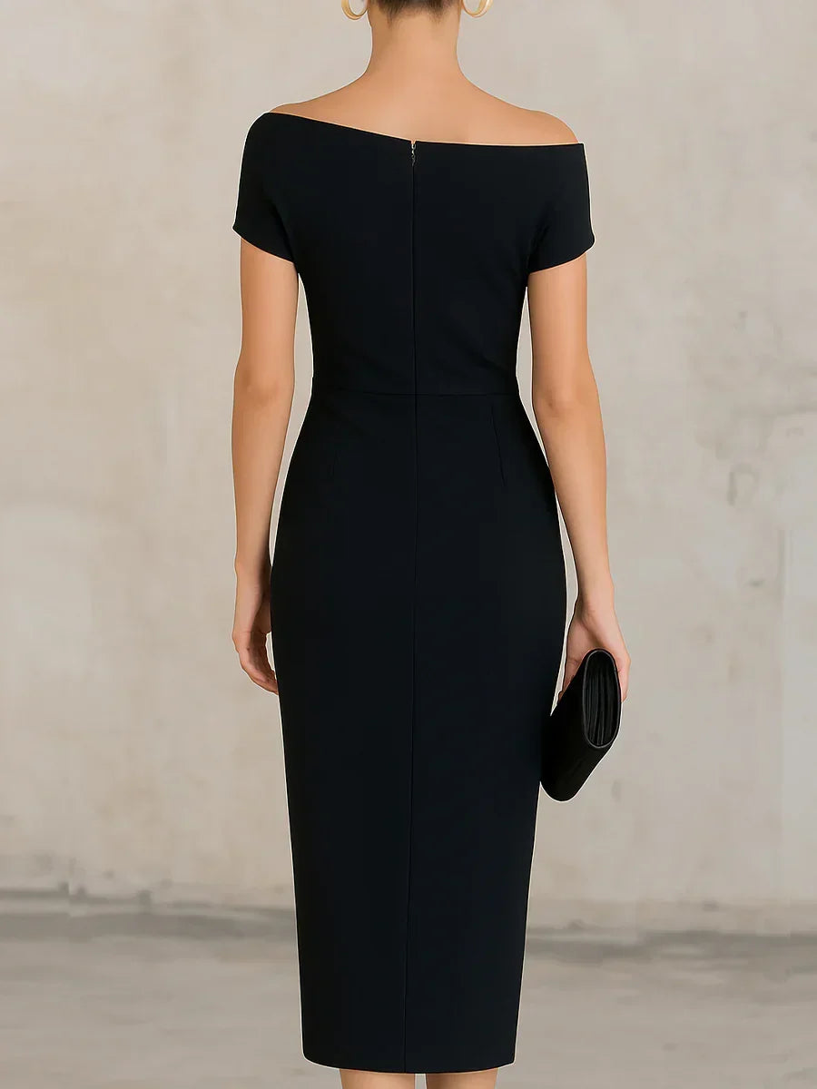 Black off-shoulder dress worn by a model against a neutral background
