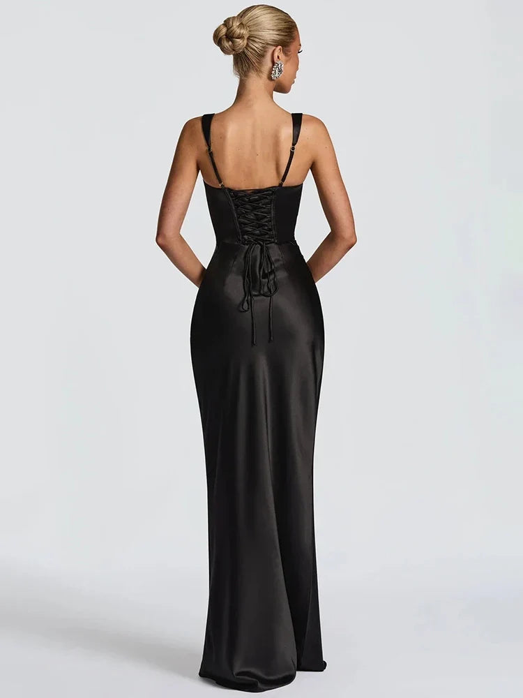 Black evening gown with open back on a white background