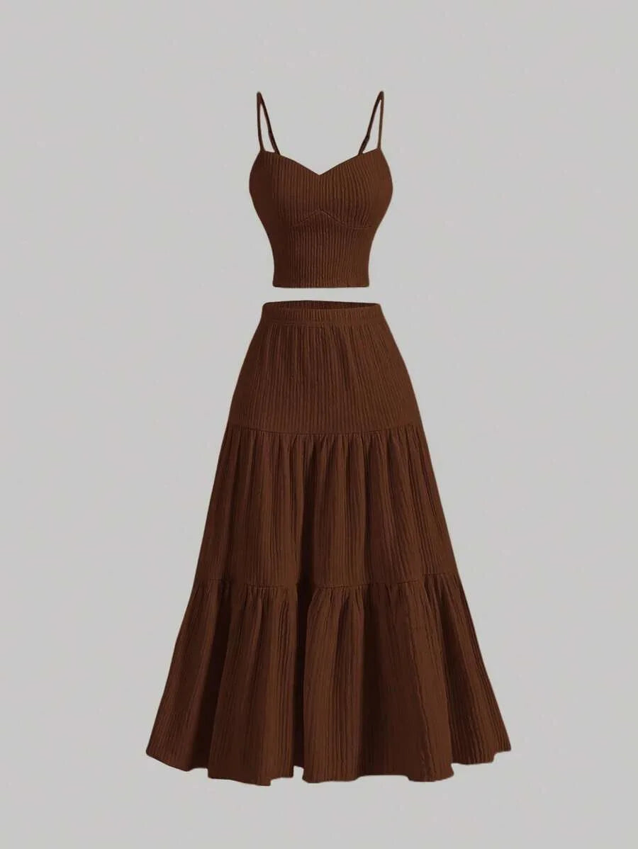 Brown two-piece outfit with a top and tiered skirt on a light gray background